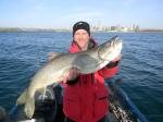 Milwaukee Harbor, WI Captain Doug Kloet with giant lake trout March 2012
