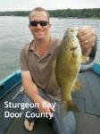 Sturgeon Bay Door county Wisconsin Captain Doug Kloet with nice smallmouth bass May 2012
