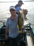 Lake Geneva, Wisconsin Captain Doug Kloet with a nice bass July 2012 